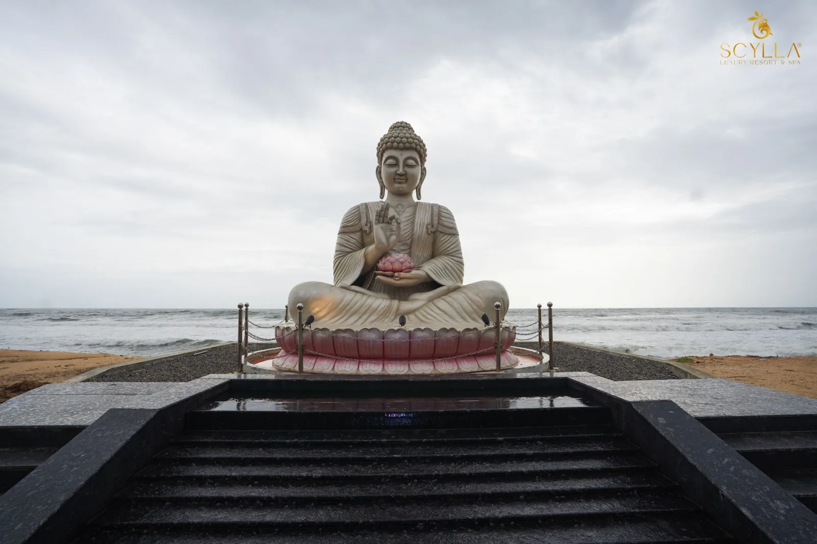Beachfront Buddha statue facing Arabian Sea at Scylla Luxury Resort & Spa